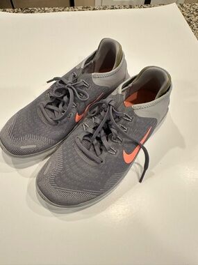 Nike Women's free run Athletic Sneakers with Coral Swoosh